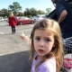 The lady in the red car pays Daddy to cry.