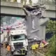 devastating crash: a large truck tears through an overpass, halting traffic completely